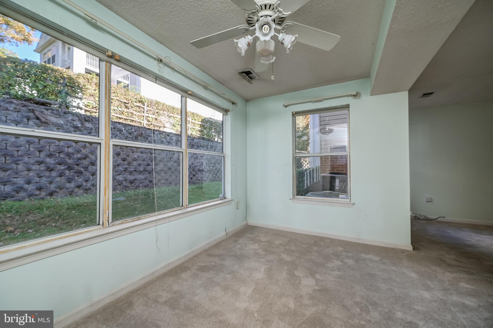 14202 Valleyfield Drive, Unit 338 Silver Spring, MD 20906 - Photo 16 of 38 a view of an empty room with a window