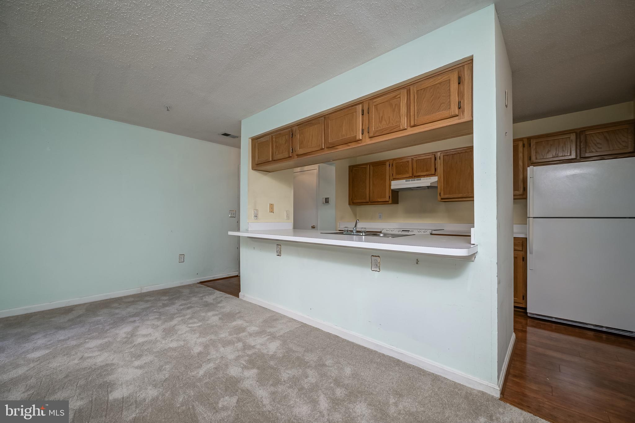 14202 Valleyfield Drive, Unit 338 Silver Spring, MD 20906 - Photo 17 of 38 a kitchen with a cabinets and stainless steel appliances