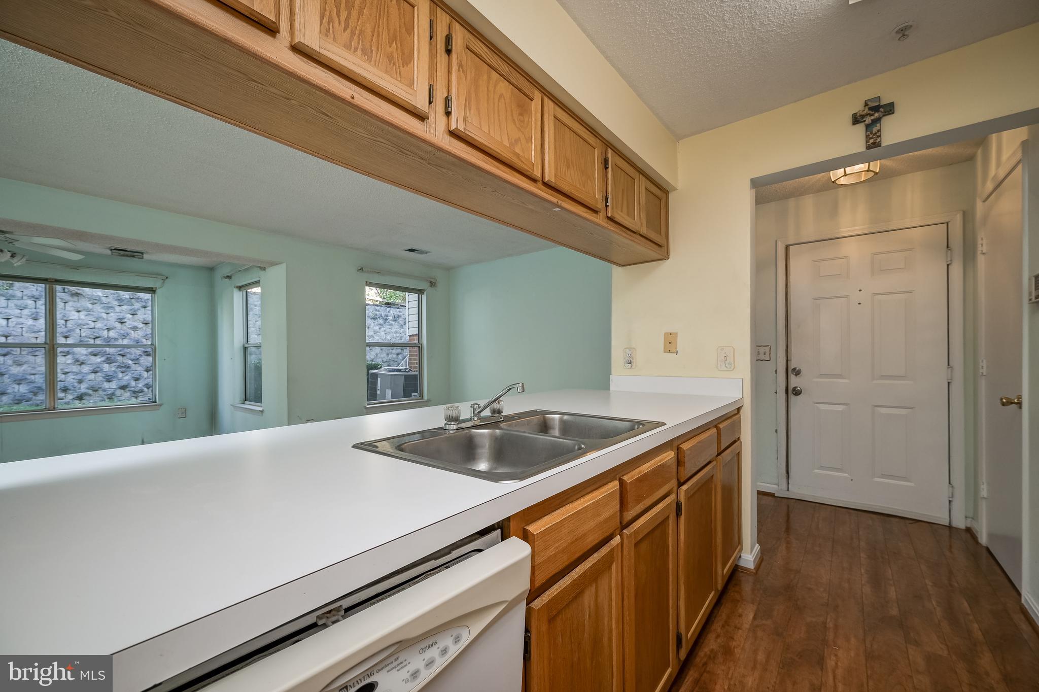 14202 Valleyfield Drive, Unit 338 Silver Spring, MD 20906 - Photo 22 of 38 a kitchen with a sink and cabinets