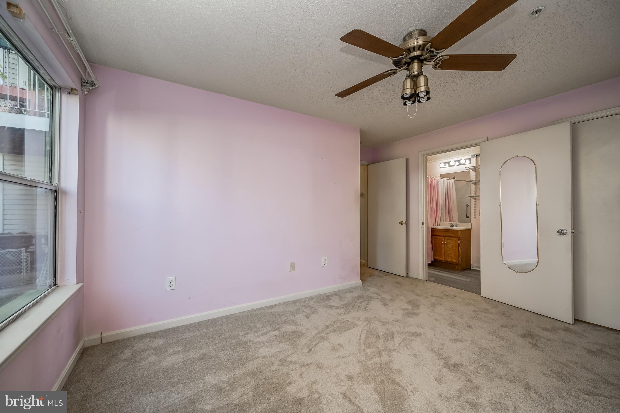 14202 Valleyfield Drive, Unit 338 Silver Spring, MD 20906 - Photo 26 of 38 en empty room with fan