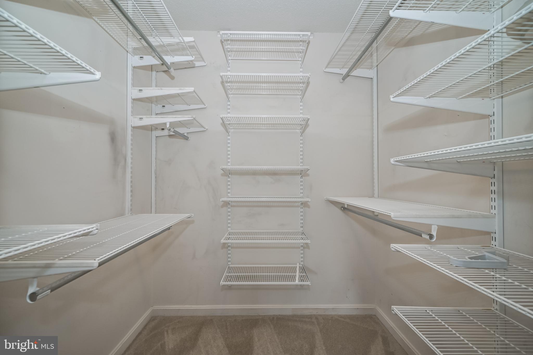 14202 Valleyfield Drive, Unit 338 Silver Spring, MD 20906 - Photo 30 of 38 a view of an empty walk in closet