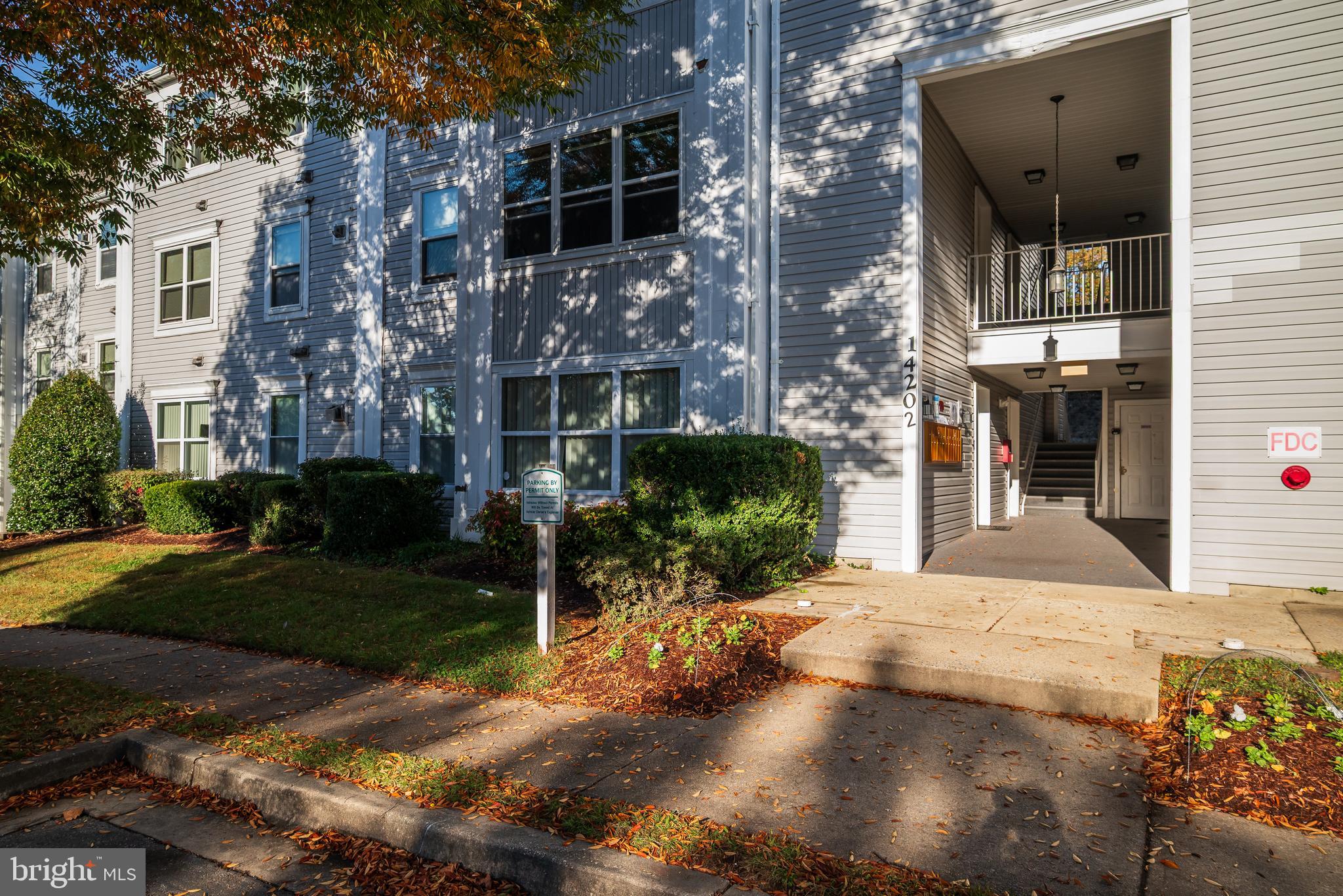 14202 Valleyfield Drive, Unit 338 Silver Spring, MD 20906 - Photo 3 of 38 a view of a porch with a yard