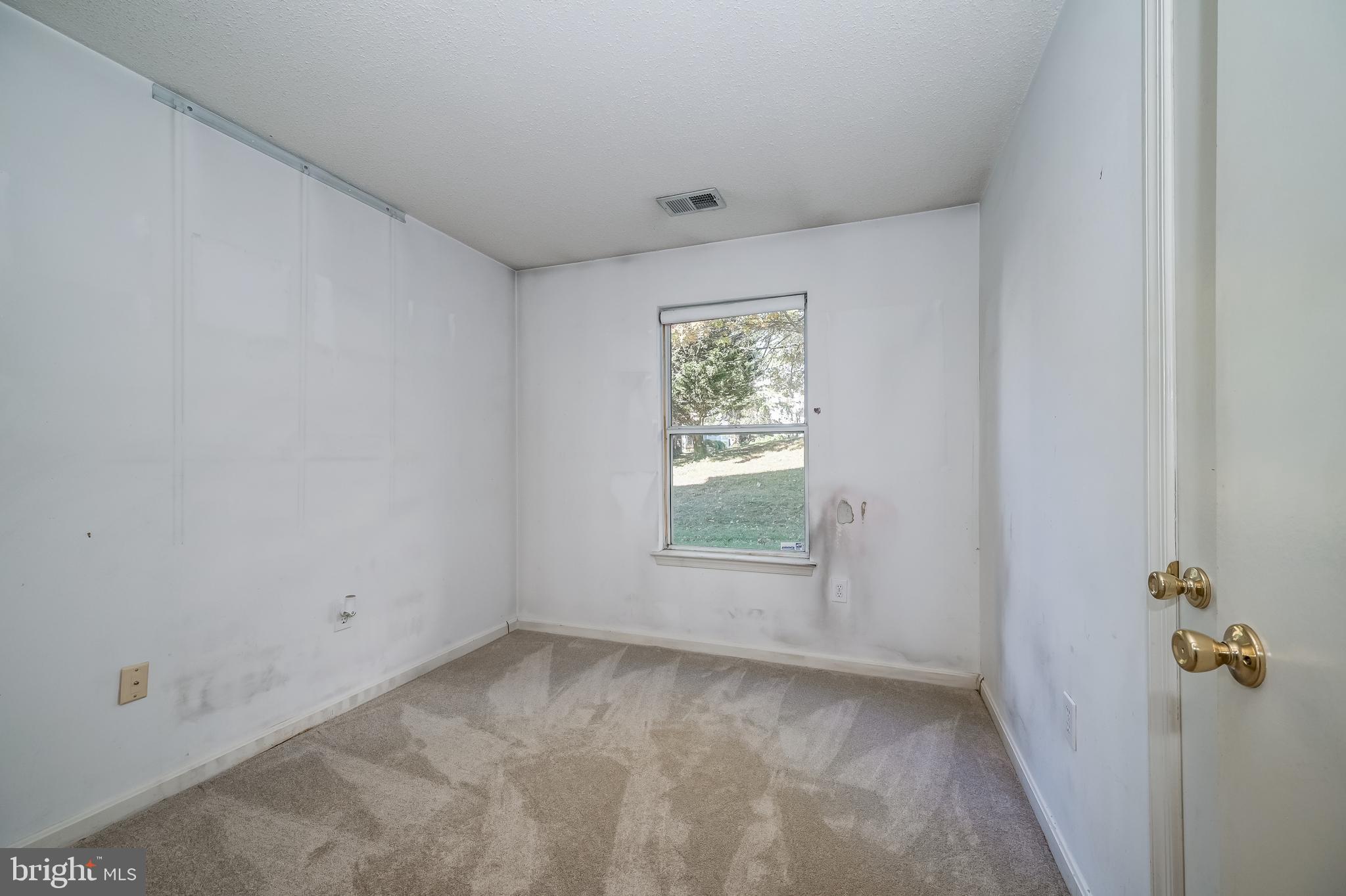 14202 Valleyfield Drive, Unit 338 Silver Spring, MD 20906 - Photo 31 of 38 an empty room with a window
