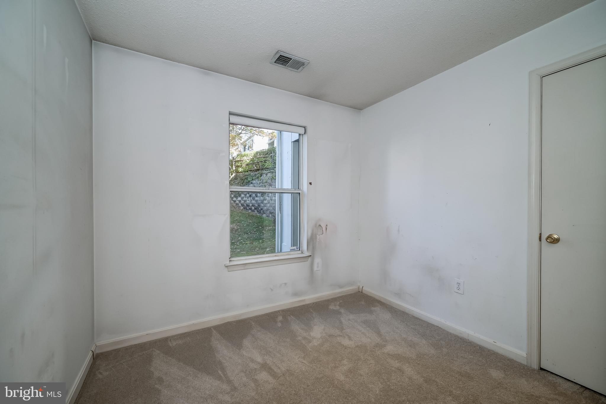 14202 Valleyfield Drive, Unit 338 Silver Spring, MD 20906 - Photo 33 of 38 an empty room with a window