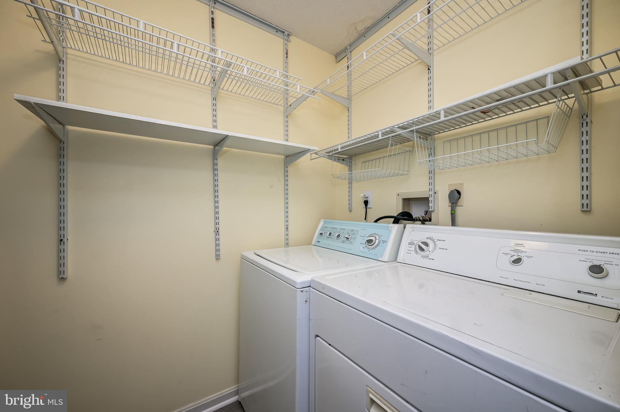 14202 Valleyfield Drive, Unit 338 Silver Spring, MD 20906 - Photo 38 of 38 a utility room with dryer and washer