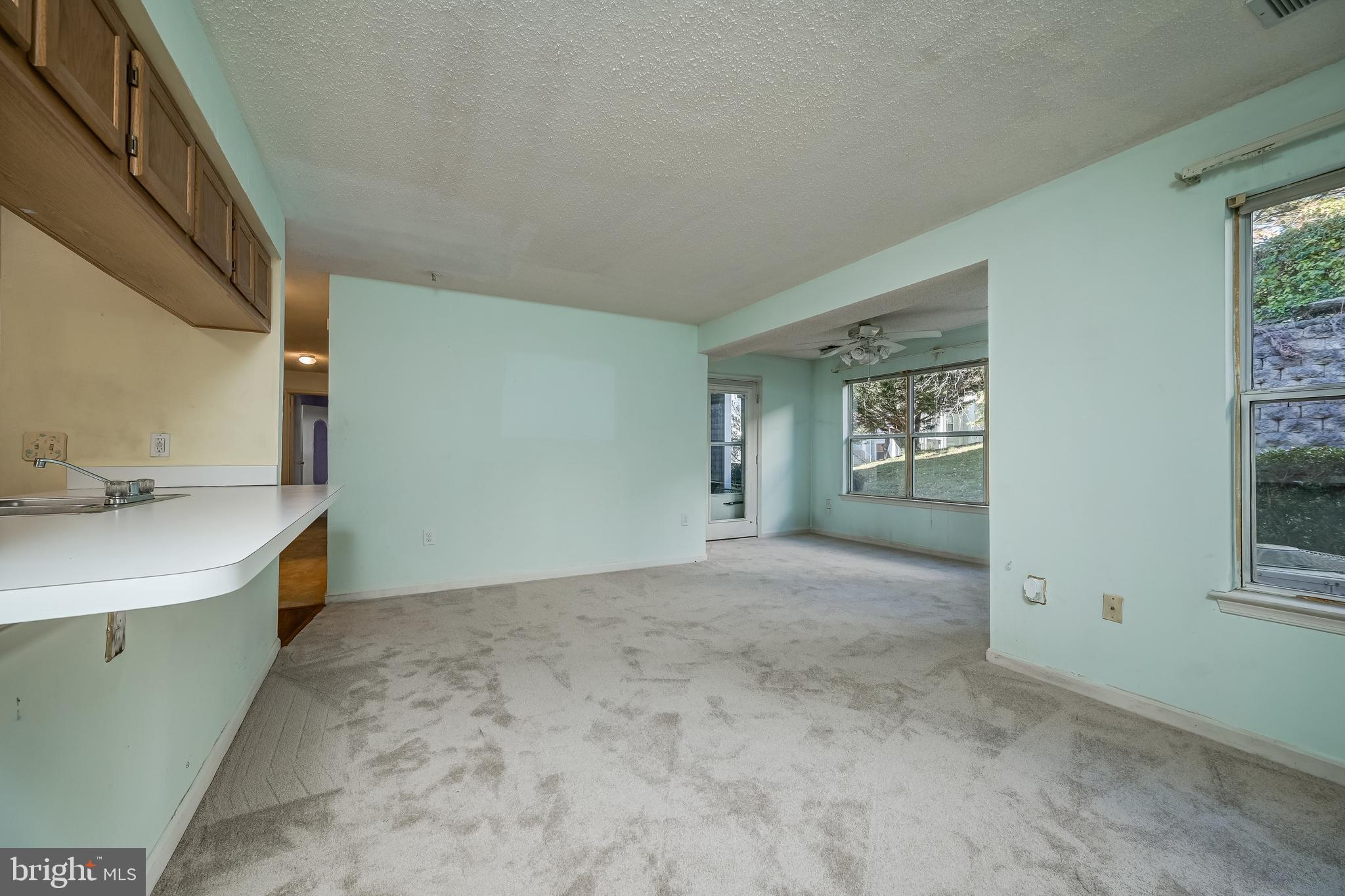 14202 Valleyfield Drive, Unit 338 Silver Spring, MD 20906 - Photo 6 of 38 a view of livingroom with kitchen
