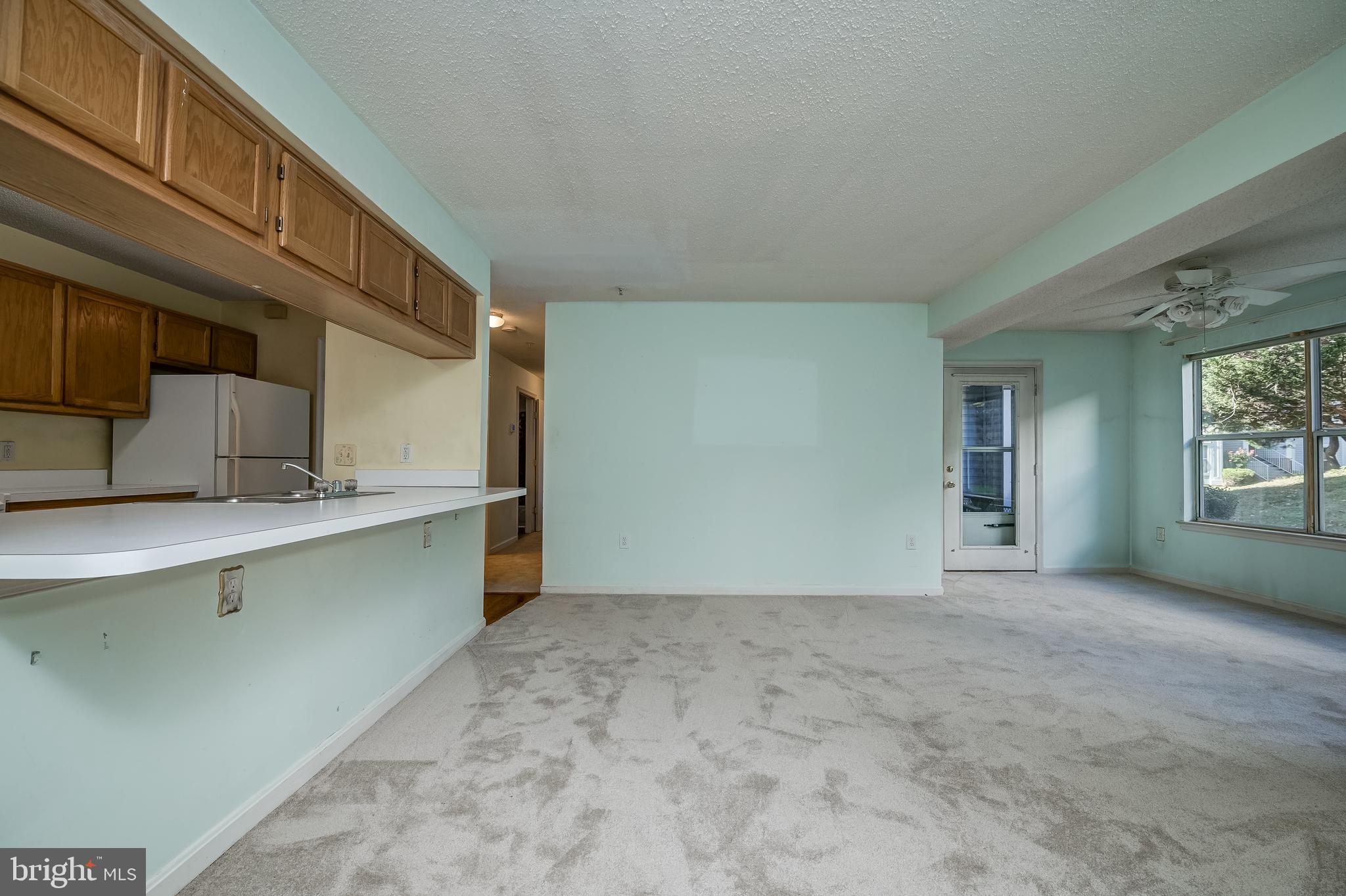 14202 Valleyfield Drive, Unit 338 Silver Spring, MD 20906 - Photo 8 of 38 a view of a kitchen with a sink and cabinets