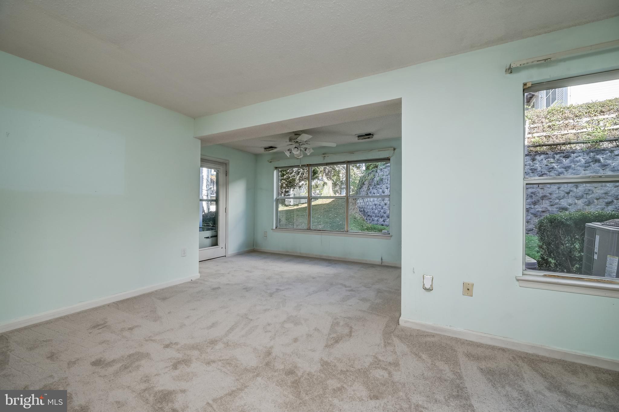 14202 Valleyfield Drive, Unit 338 Silver Spring, MD 20906 - Photo 9 of 38 an empty room with windows