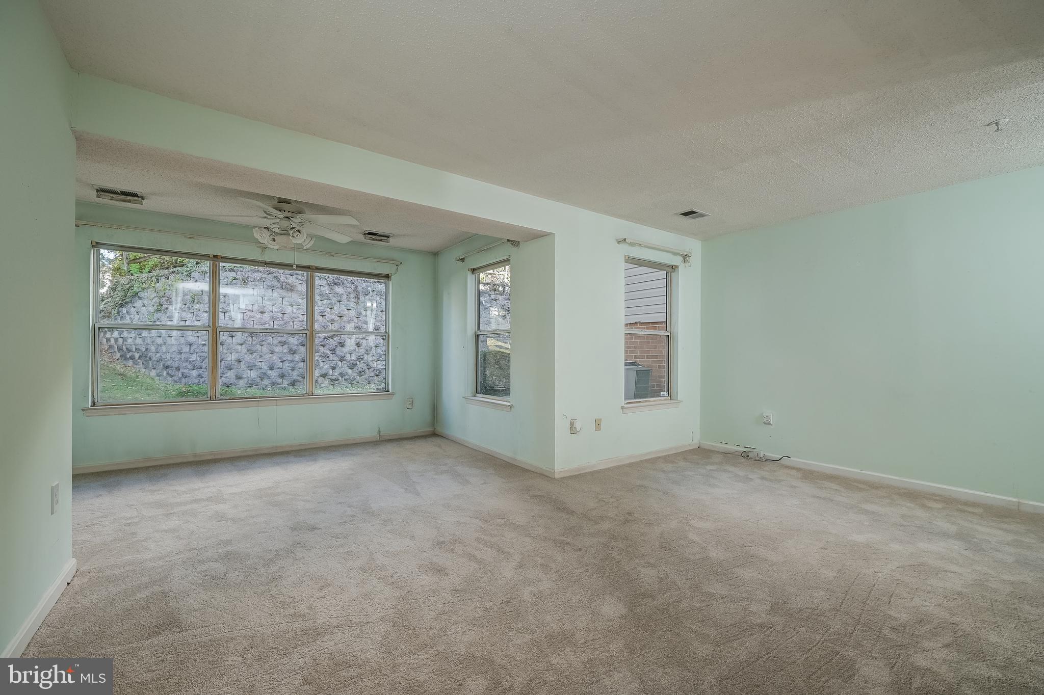 14202 Valleyfield Drive, Unit 338 Silver Spring, MD 20906 - Photo 10 of 38 an empty room with windows