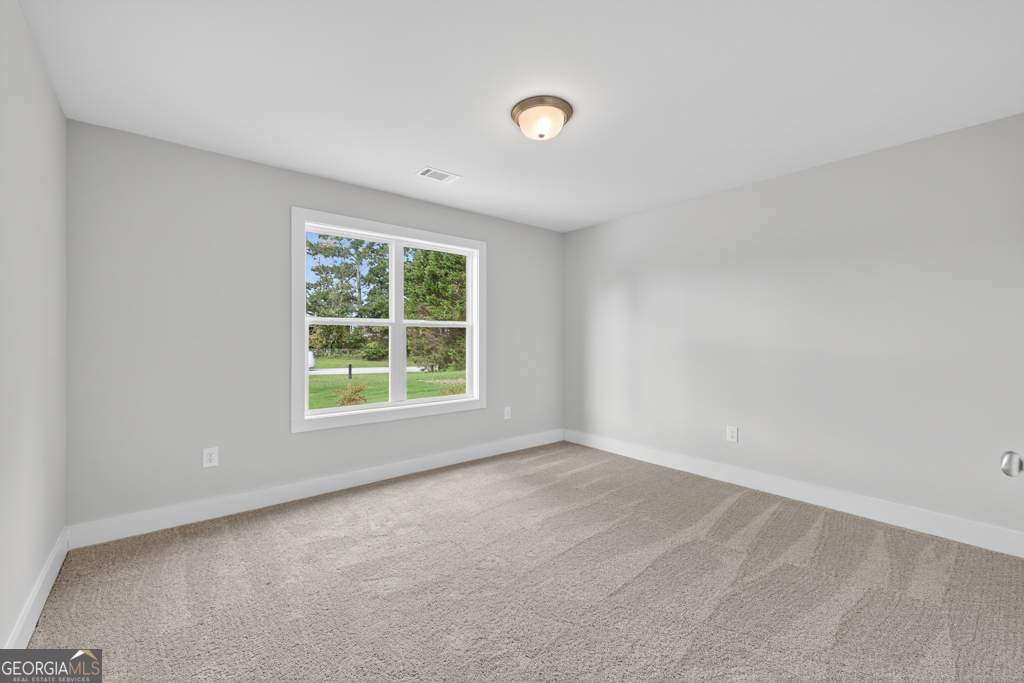 435 Watson Road Winder, GA 30680 - Photo 16 of 36 an empty room with a window