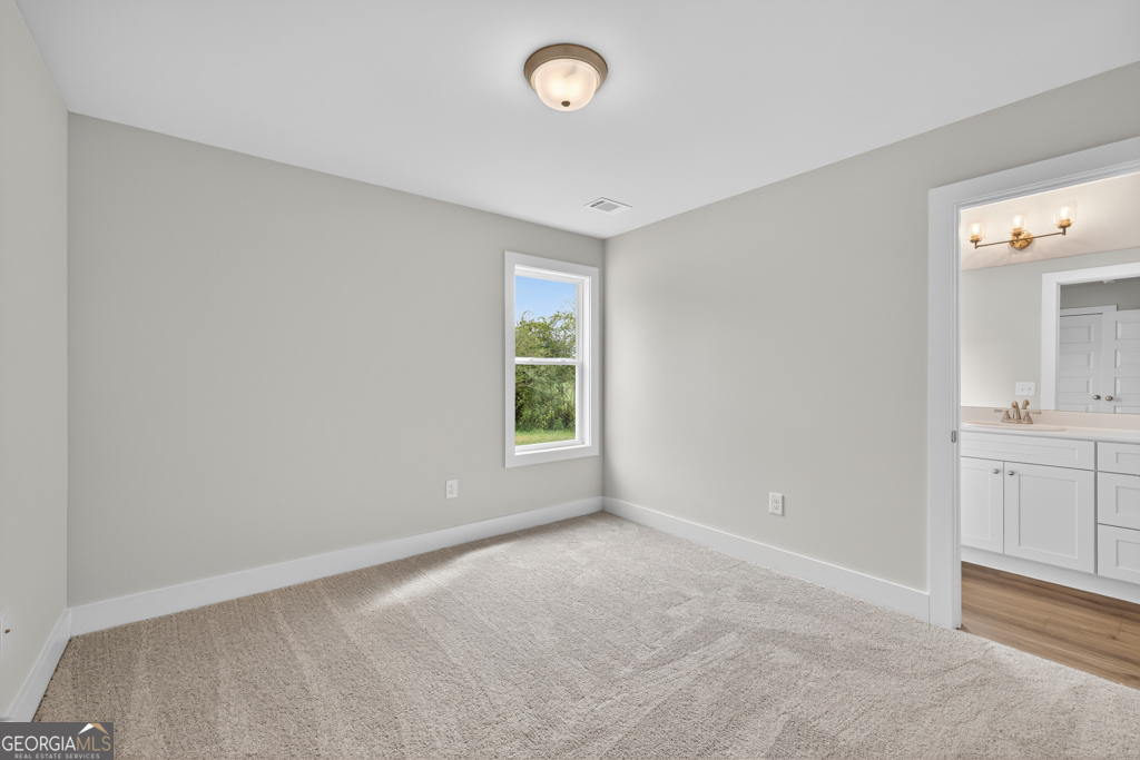 435 Watson Road Winder, GA 30680 - Photo 22 of 36 a view of an empty room with a window