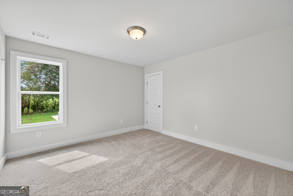435 Watson Road Winder, GA 30680 - Photo 24 of 36 an empty room with windows
