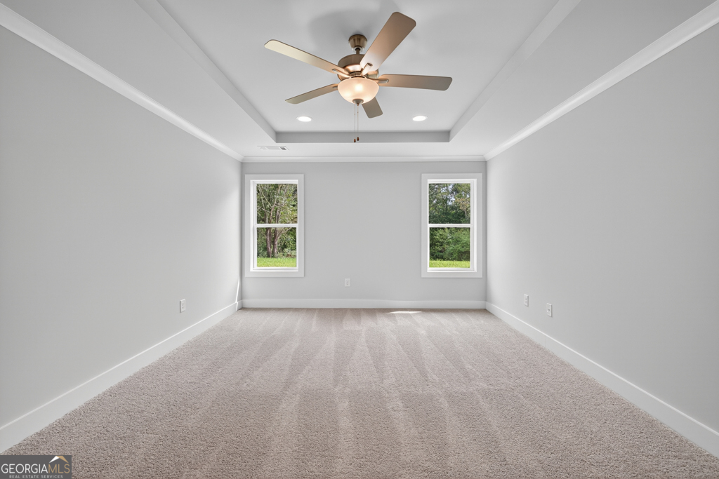 435 Watson Road Winder, GA 30680 - Photo 28 of 36 an empty room with ceiling fan and window