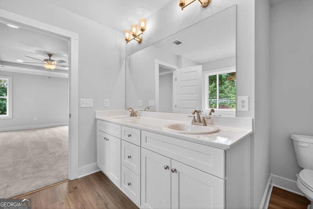 435 Watson Road Winder, GA 30680 - Photo 35 of 36 a bathroom with a sink double vanity and a mirror