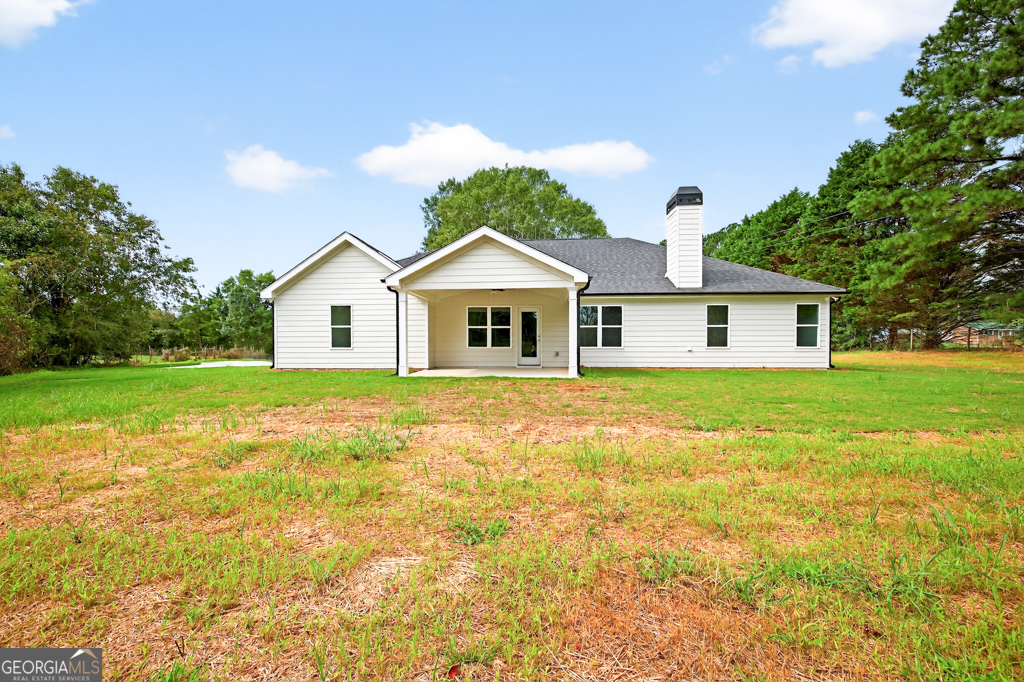 435 Watson Road Winder, GA 30680 - Photo 36 of 36 a front view of a house with yard and green space