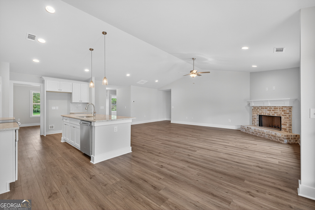 435 Watson Road Winder, GA 30680 - Photo 8 of 36 a view of kitchen with kitchen island stainless steel appliances refrigerator stove microwave and cabinets