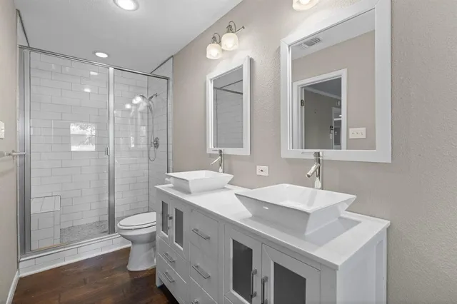 a bathroom with a bathtub and next to a window