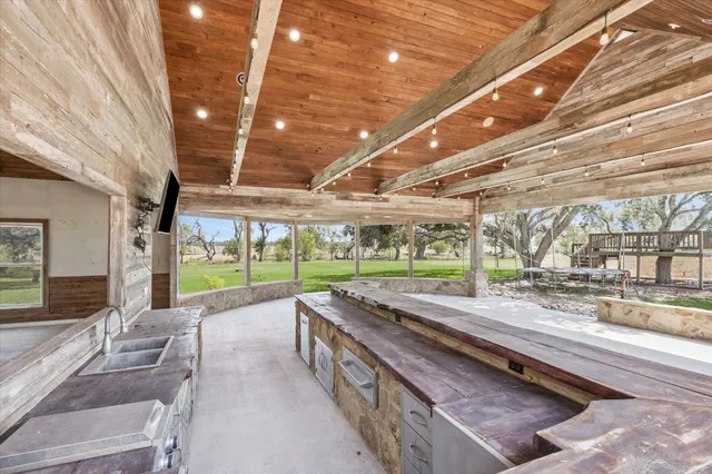a view of a hall with wooden floor