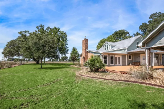 a view of a house with a big yard