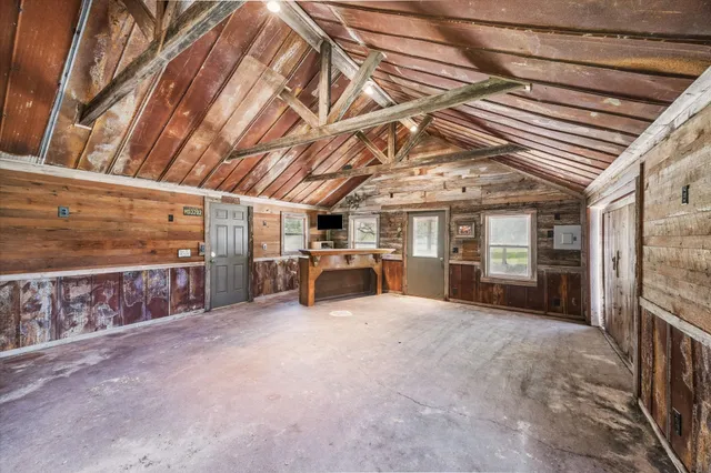 a house view with garden space and trees