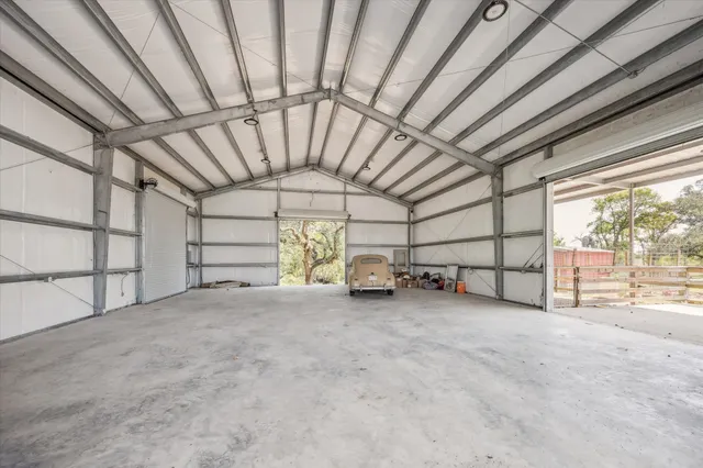 a grassy field with trees in the background
