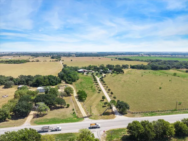 a view of a park with large trees