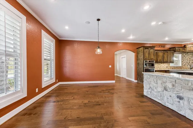 a view of a kitchen with a sink and a window
