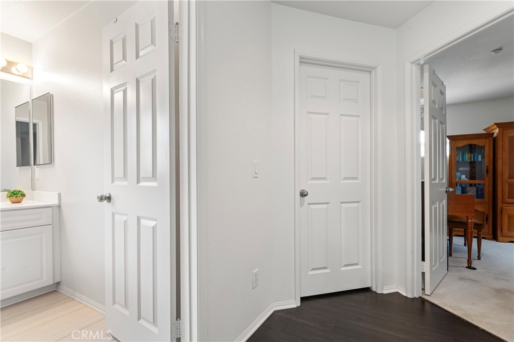 1339 Castledale Street Riverside, CA 92501 - Photo 19 of 32 a view of a hallway with wooden floor and closet area