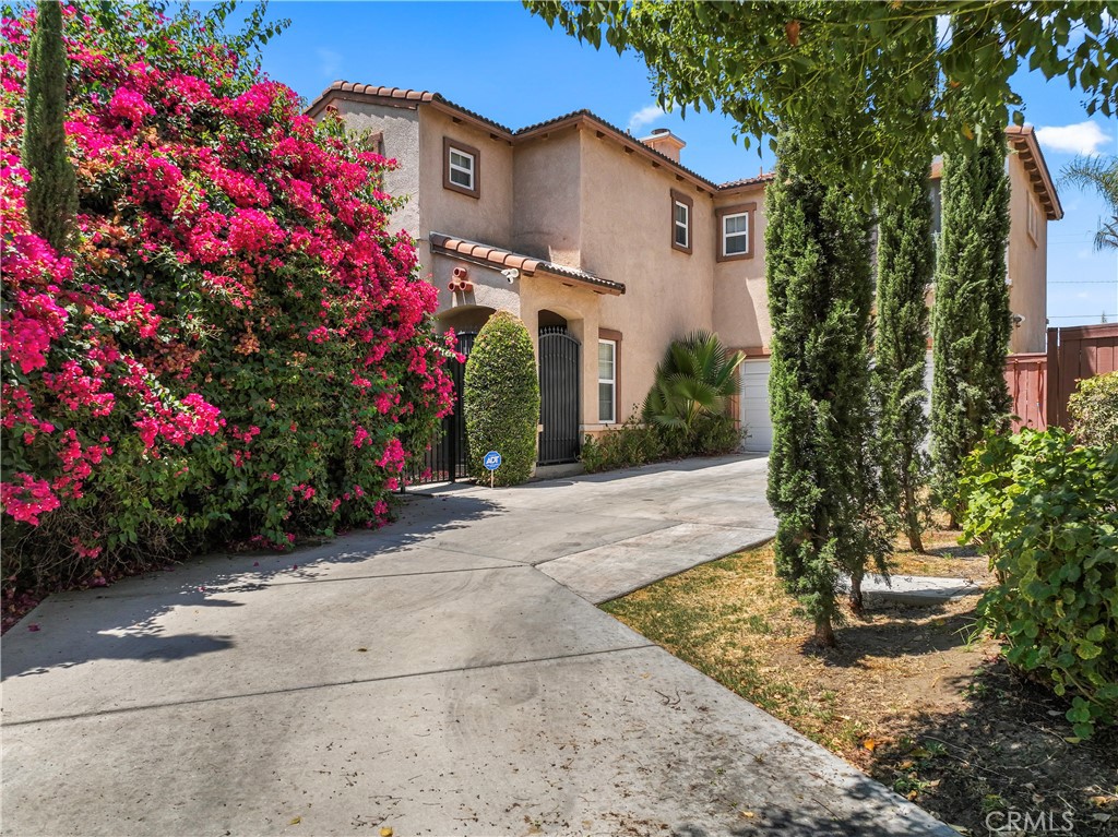 1339 Castledale Street Riverside, CA 92501 - Photo 2 of 32 a front view of a house with a yard and fountain