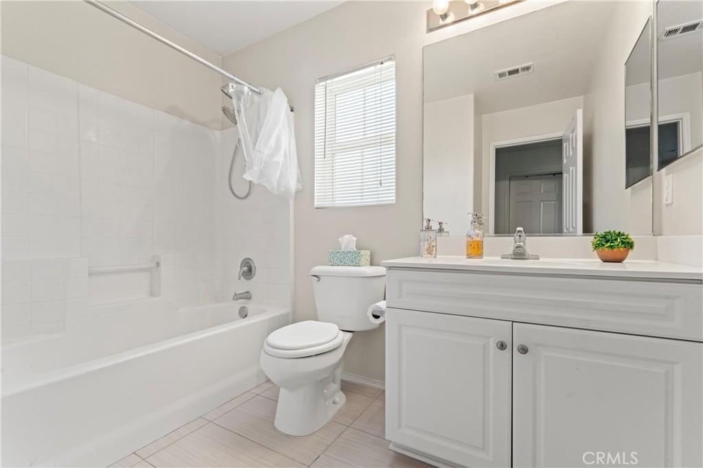 1339 Castledale Street Riverside, CA 92501 - Photo 26 of 32 a bathroom with a sink a toilet and shower