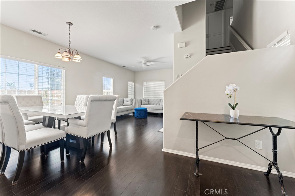 1339 Castledale Street Riverside, CA 92501 - Photo 5 of 32 a view of a dining room with furniture and wooden floor