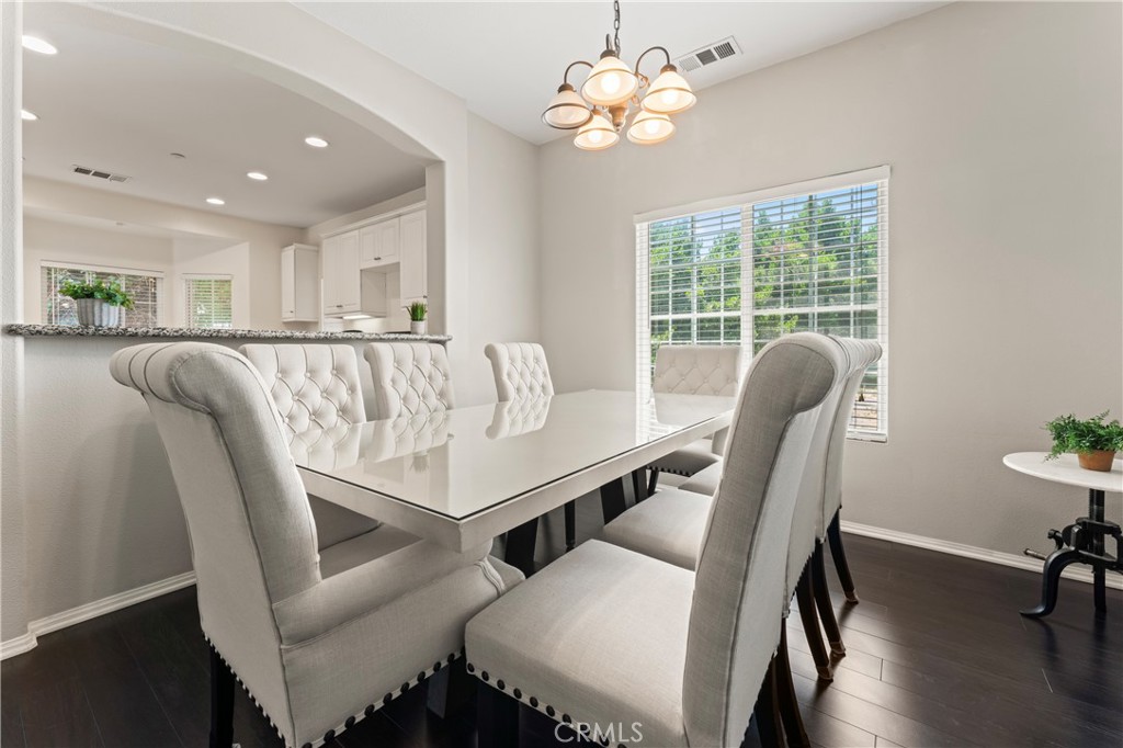 1339 Castledale Street Riverside, CA 92501 - Photo 9 of 32 a view of a dining room with furniture window and wooden floor