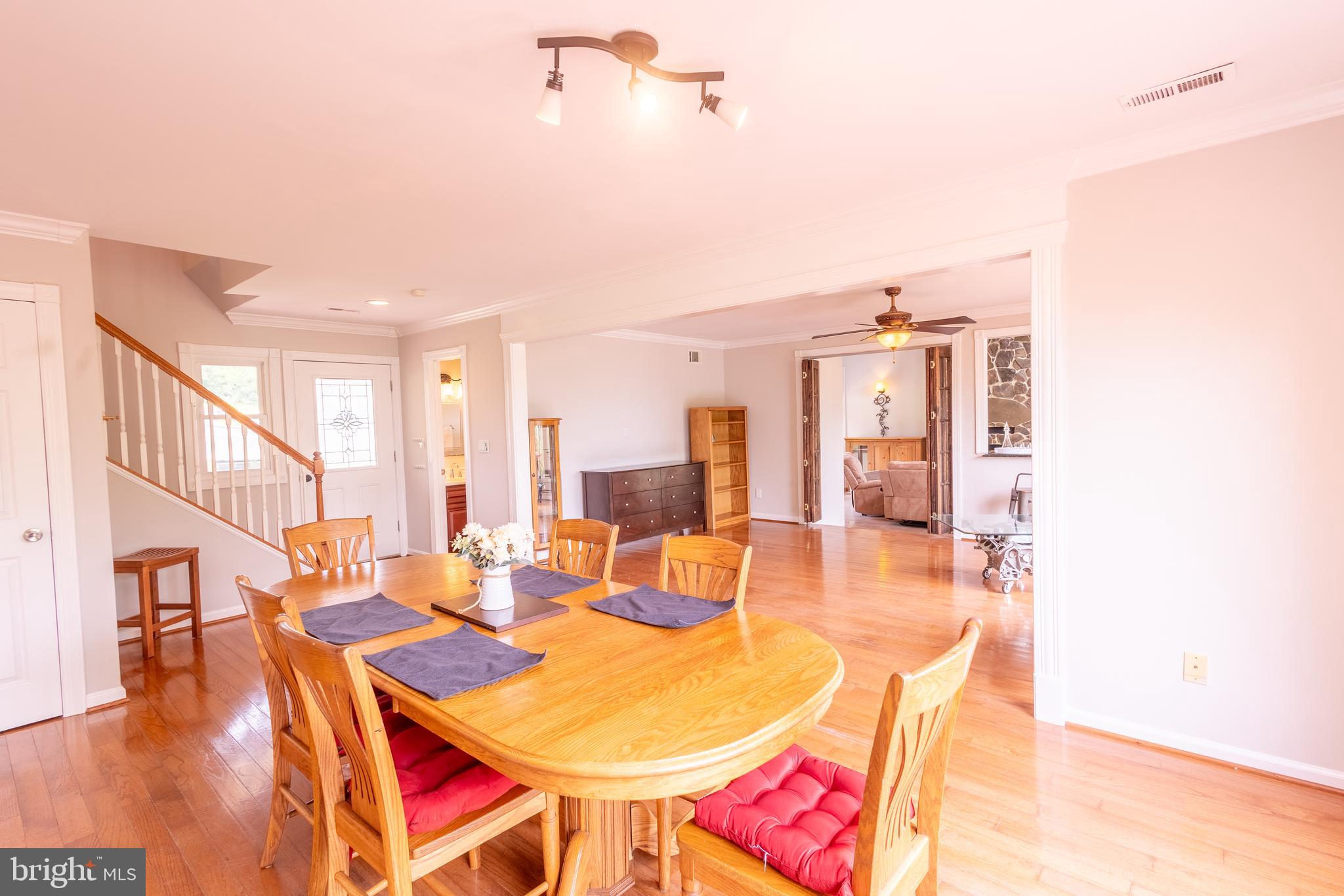 15466 Arthur Road King George, VA 22485 - Photo 13 of 46 Stairs, Dining Area, Front Door, Living Room View
