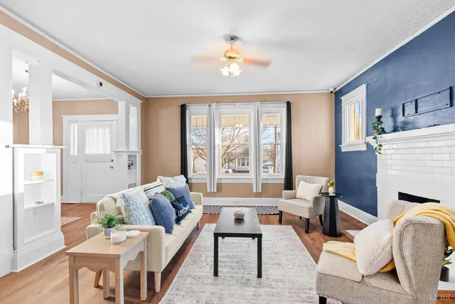 a living room with furniture and a fireplace