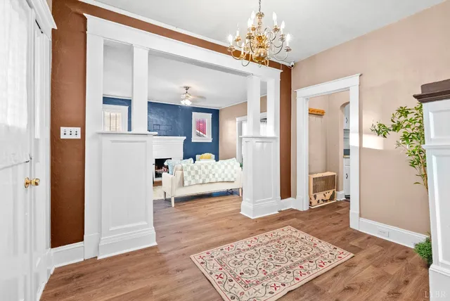 a bedroom with furniture and a rug