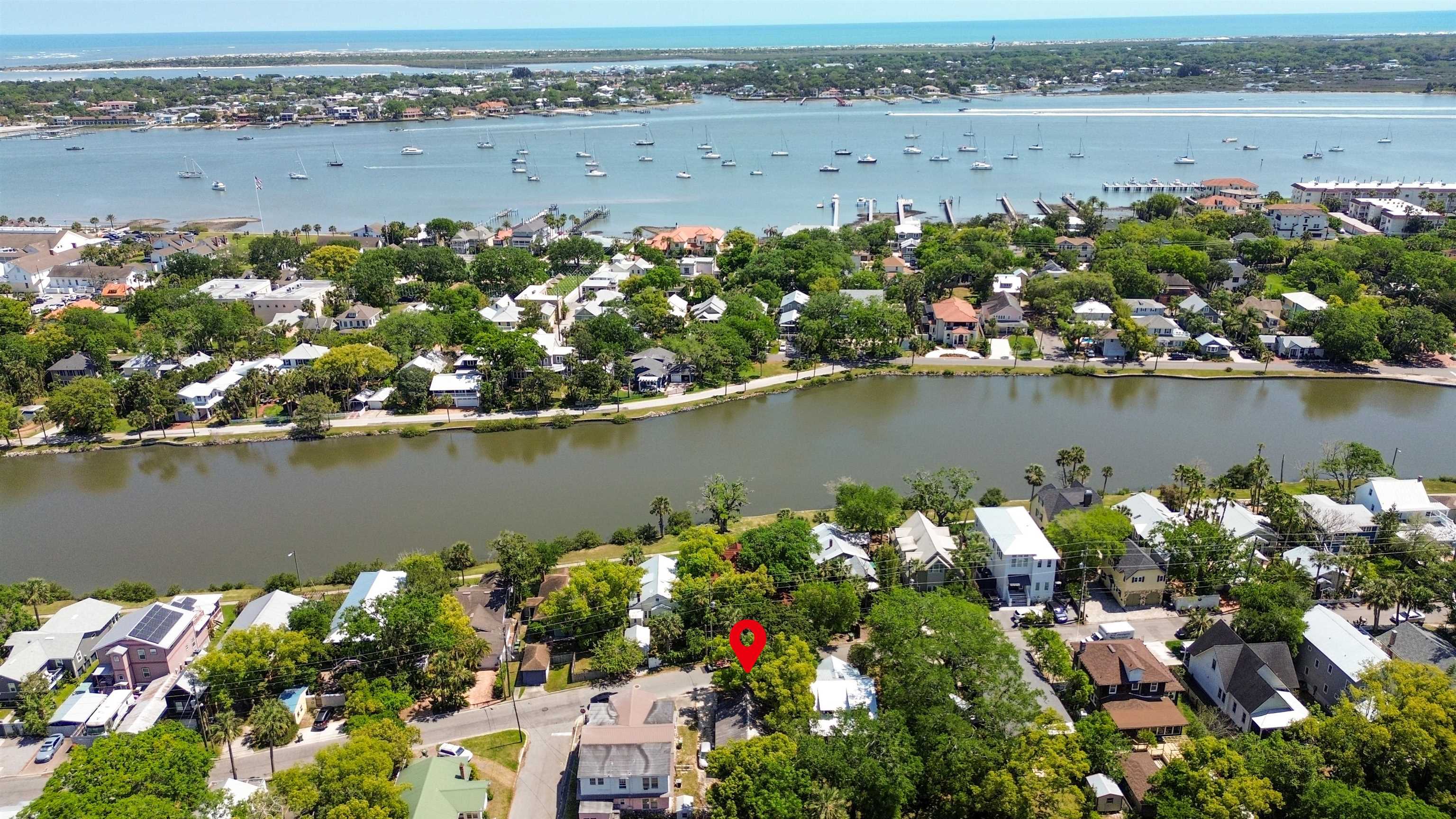an aerial view of a house with a lake view