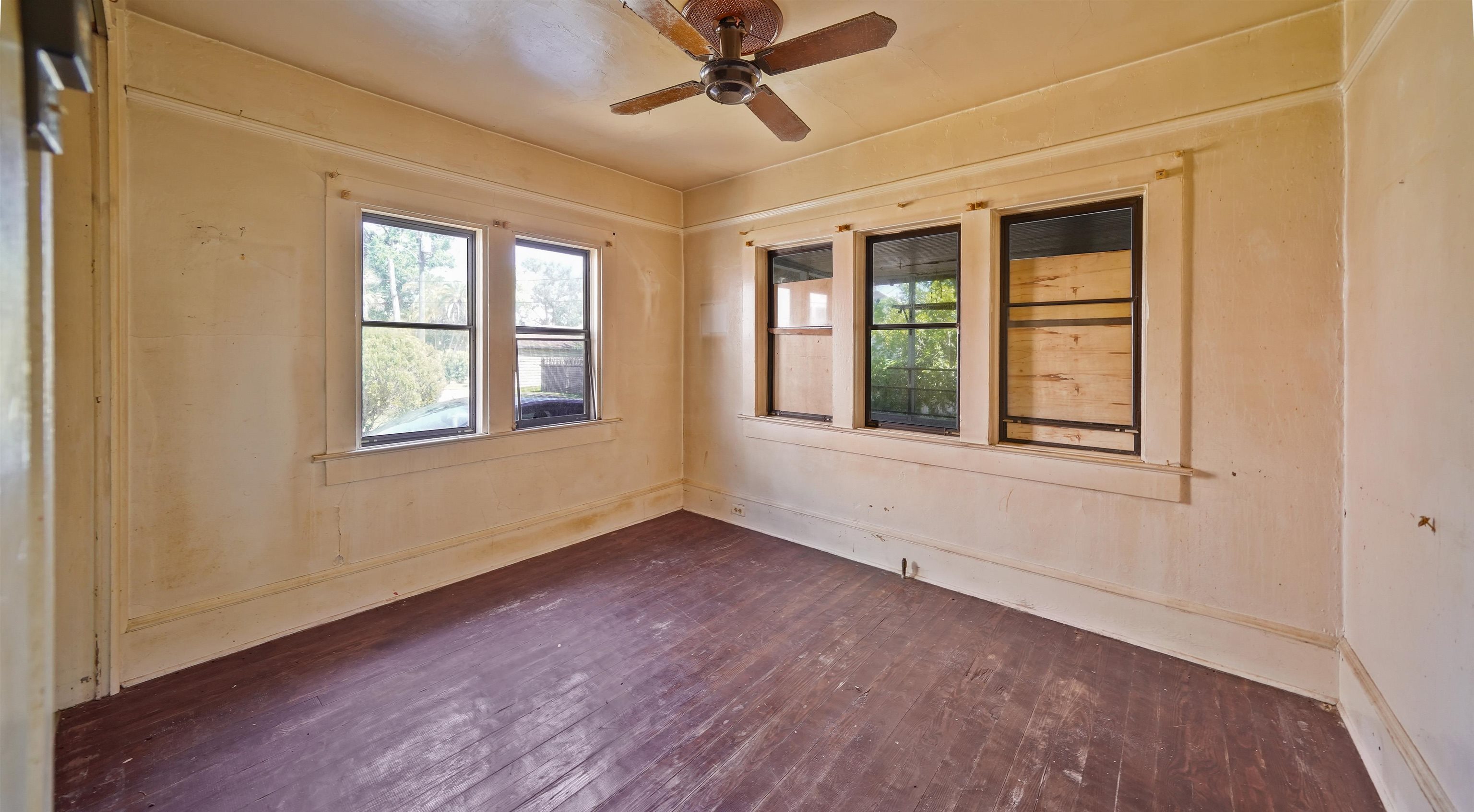 136 Washington Street St. Augustine, FL 32084 - Photo 8 of 15 a view of an empty room with a window and wooden floor