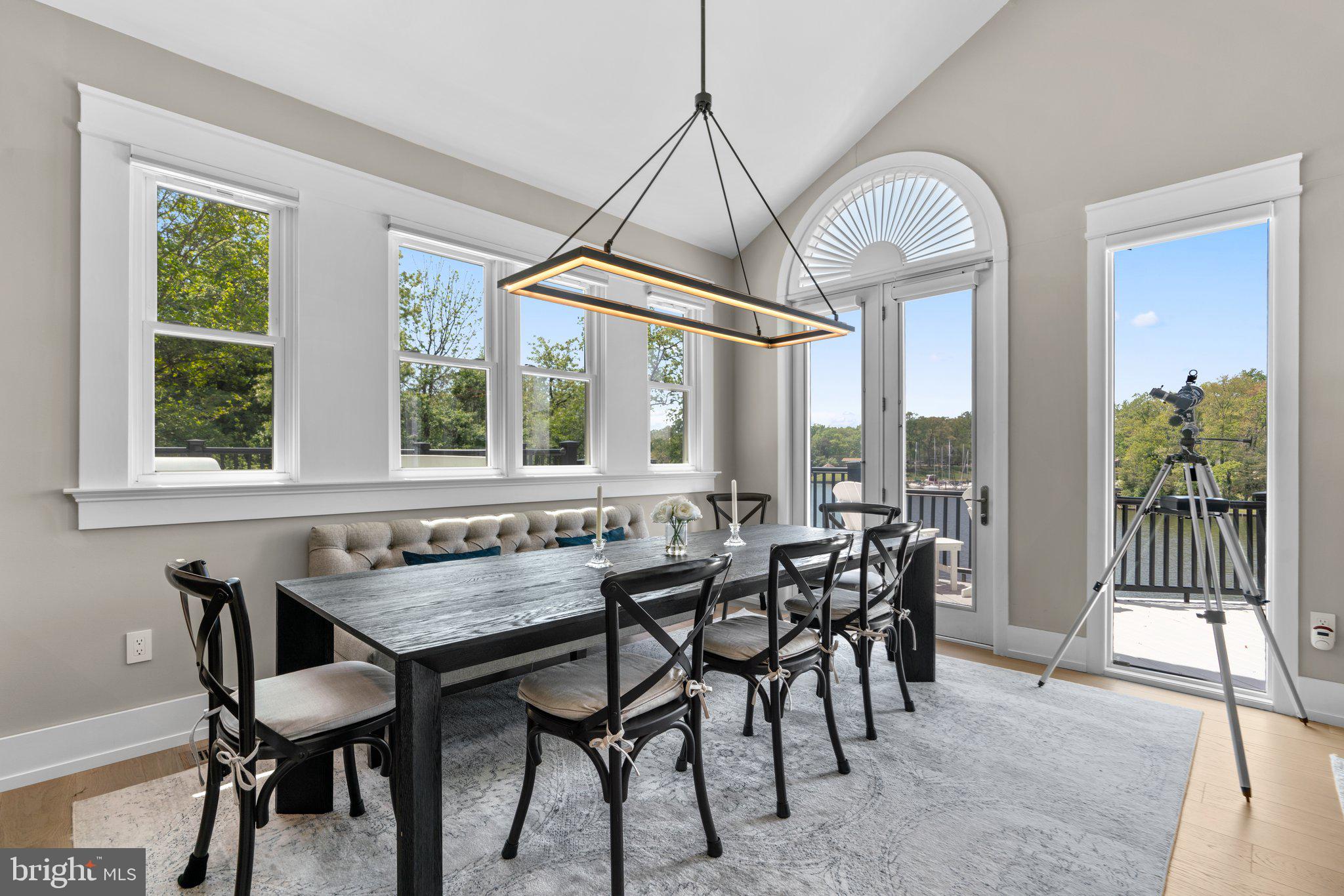 910 Lynch Drive Arnold, MD 21012 - Photo 12 of 67 a dining room with furniture a chandelier and wooden floor