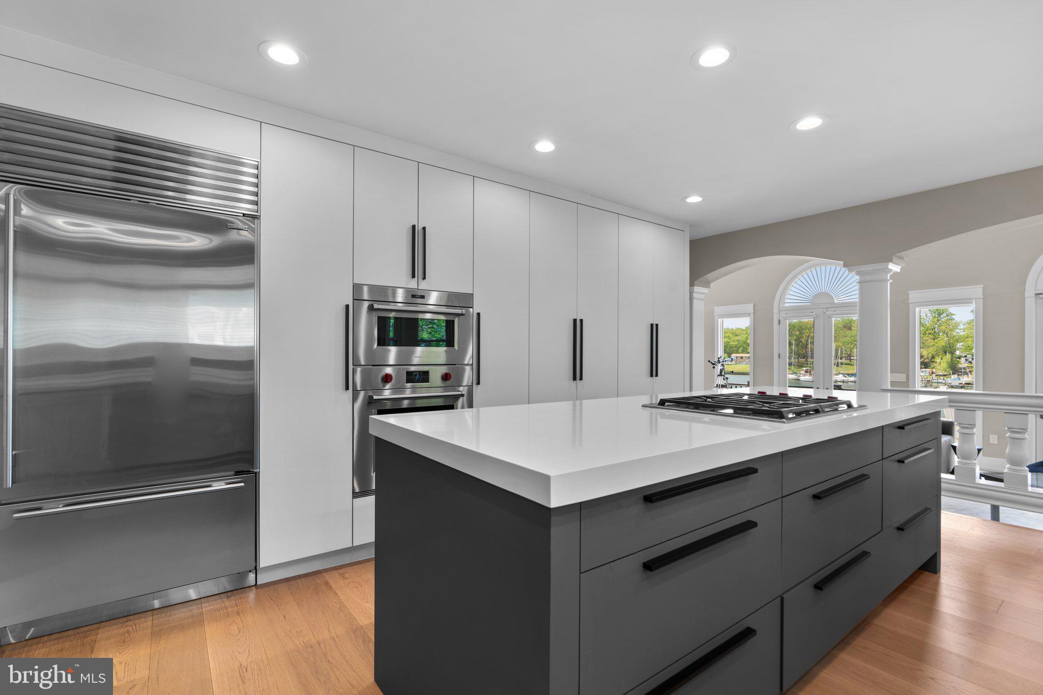 910 Lynch Drive Arnold, MD 21012 - Photo 17 of 67 a kitchen with kitchen island a sink appliances and a counter top space