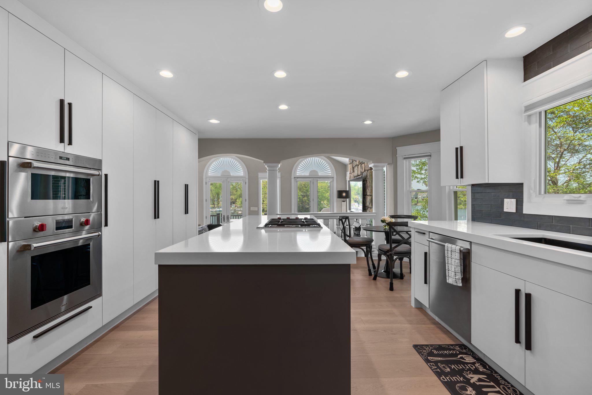 910 Lynch Drive Arnold, MD 21012 - Photo 18 of 67 a kitchen with counter top space appliances and windows