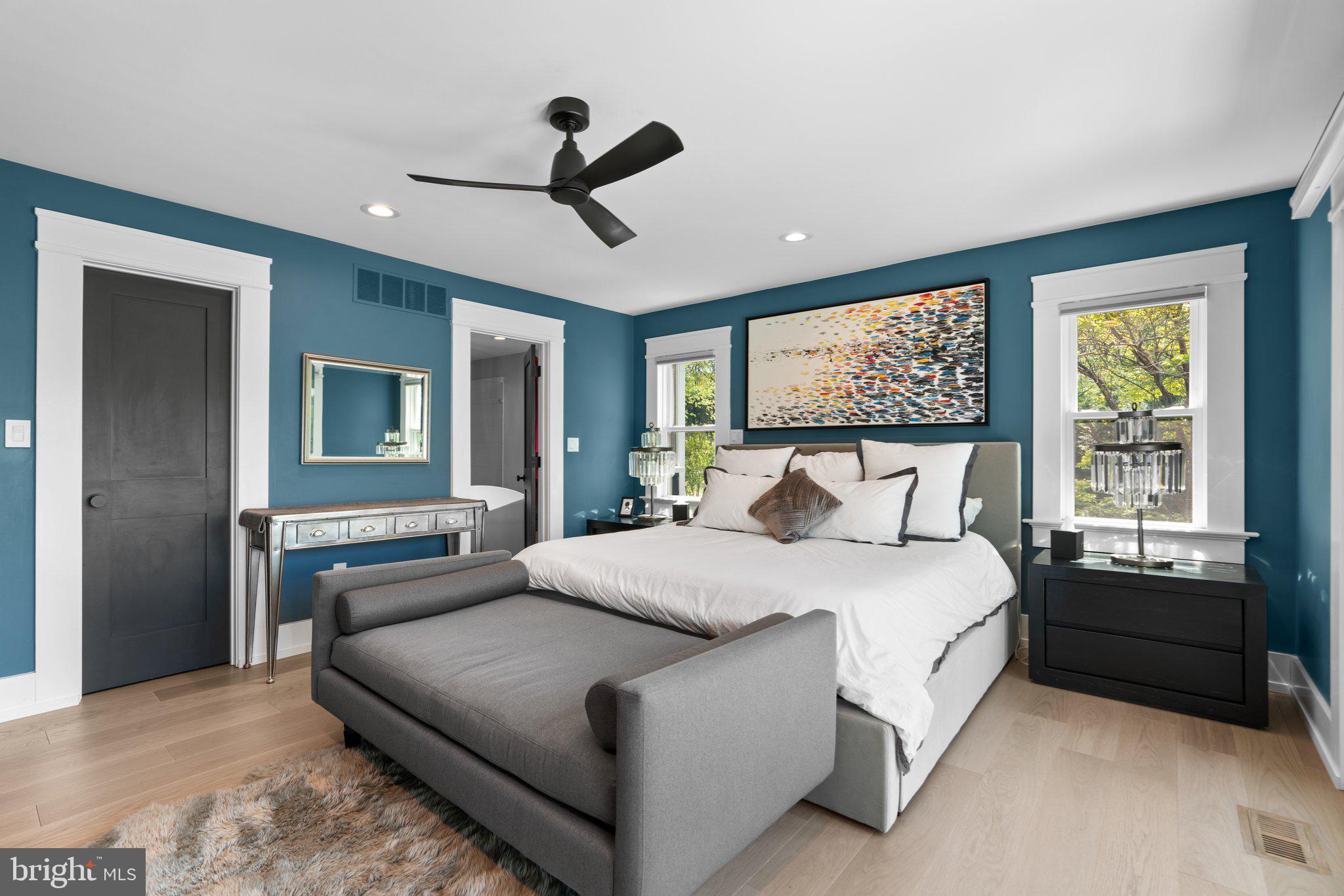 910 Lynch Drive Arnold, MD 21012 - Photo 23 of 67 a bedroom with a large bed and a chandelier