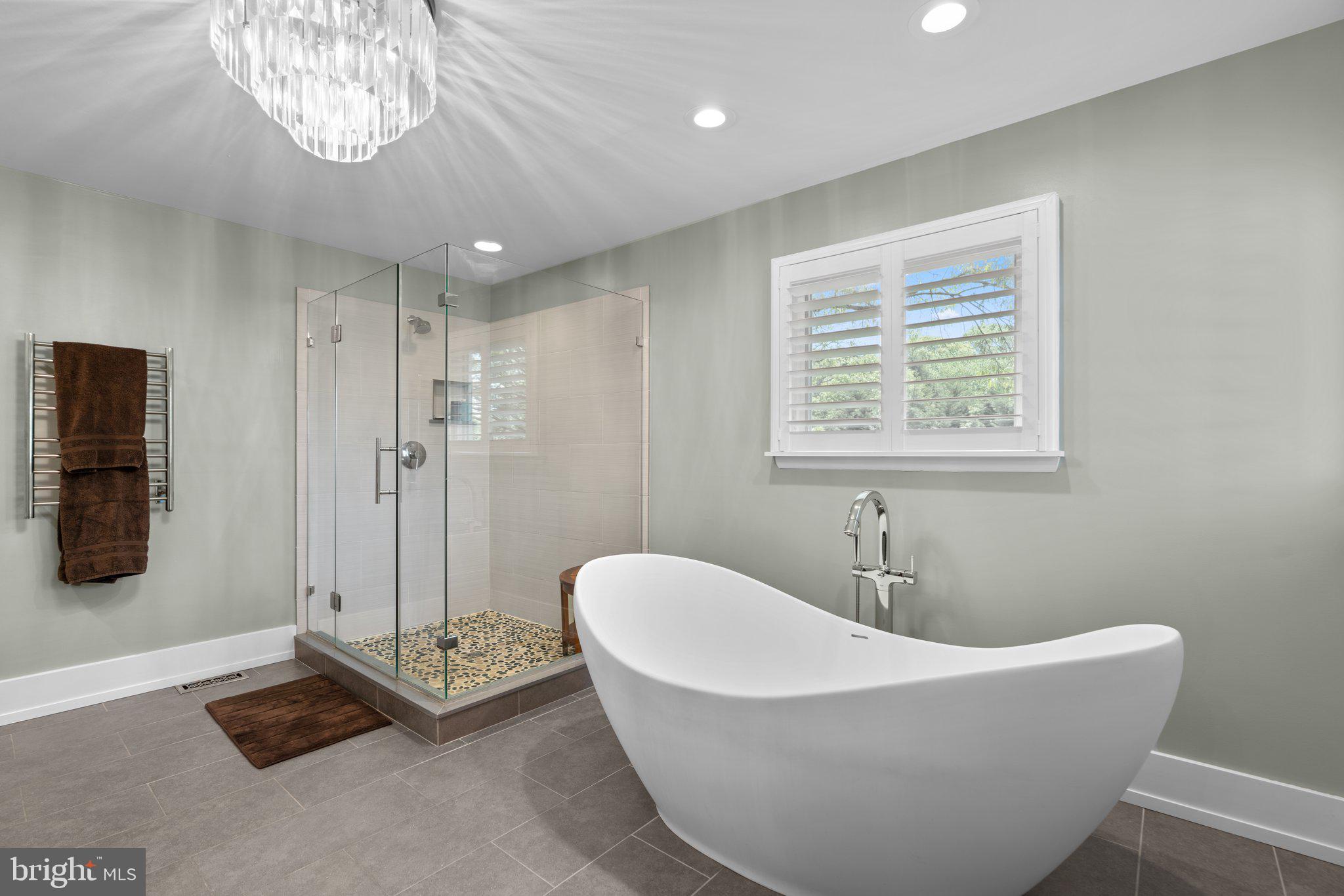 910 Lynch Drive Arnold, MD 21012 - Photo 26 of 67 a white bath tub sitting in a bathroom next to a window