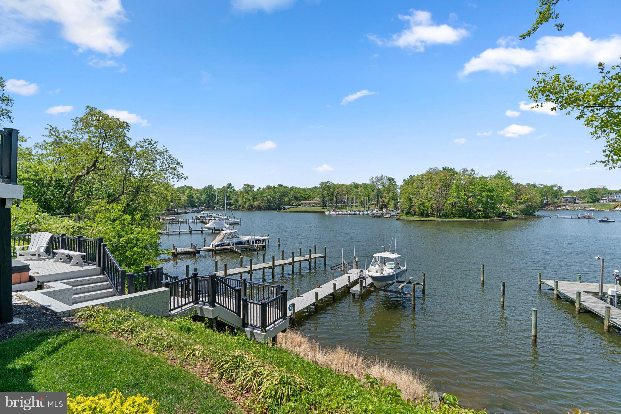 910 Lynch Drive Arnold, MD 21012 - Photo 53 of 67 a view of a lake with houses in the back