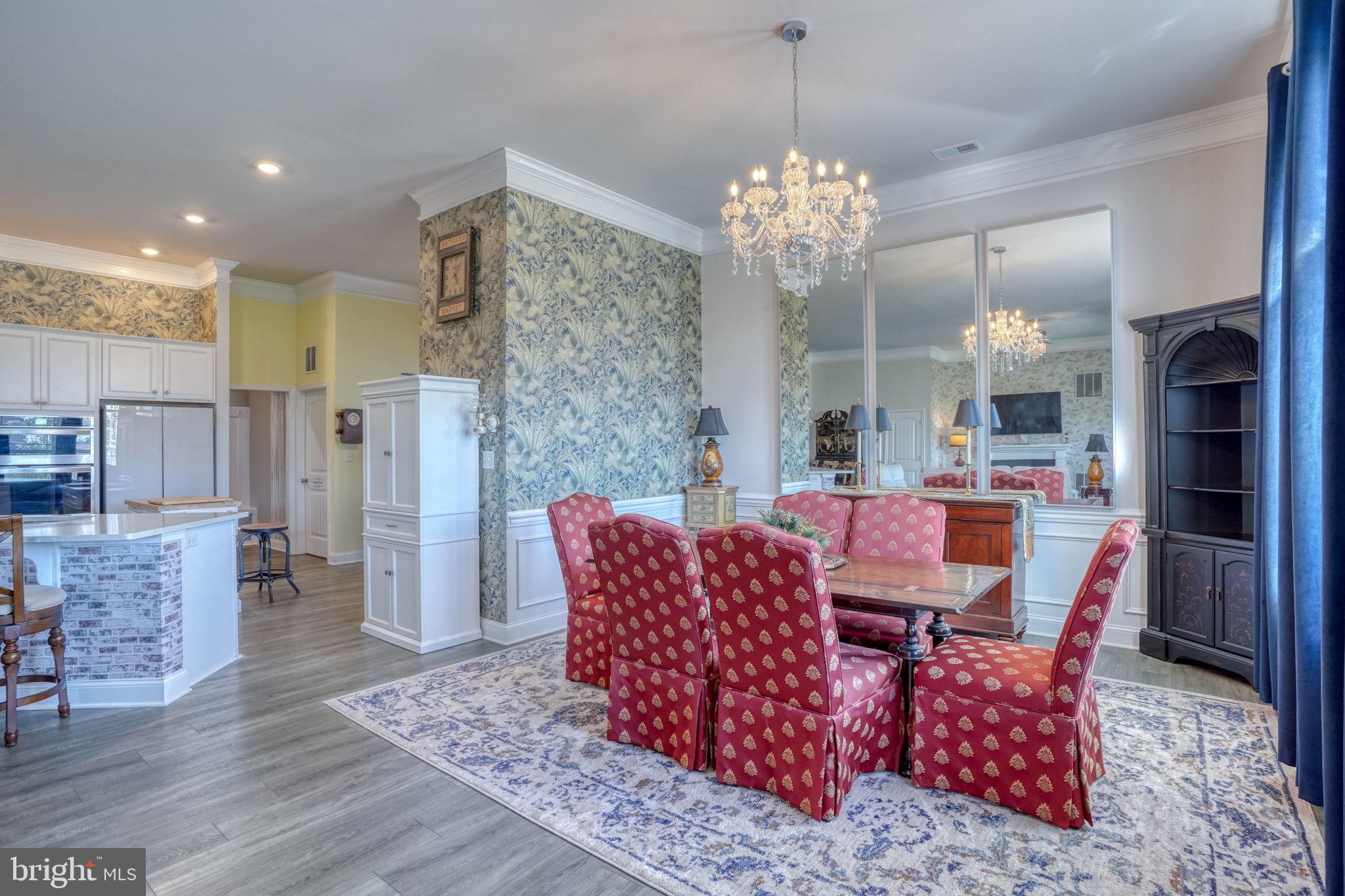 15272 Crape Myrtle Road Milton, DE 19968 - Photo 37 of 61 Charming dining area with elegant decor.