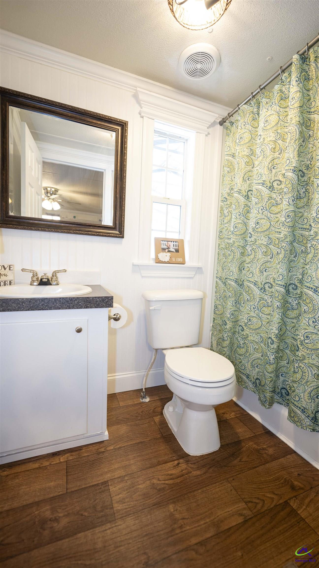 500 Old Milledgeville Road Cochran, GA 31014 - Photo 45 of 48 a bathroom with a toilet a sink and mirror