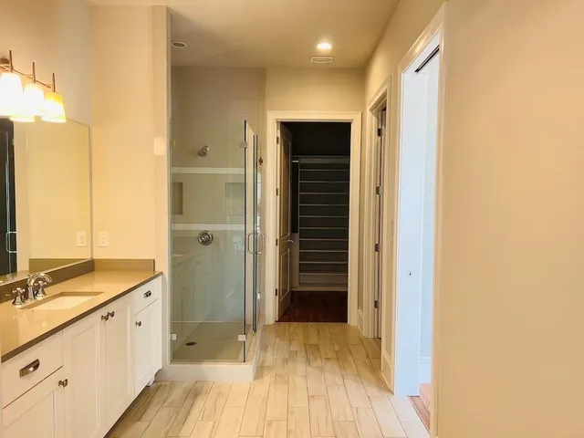 a bathroom with a double vanity sink and a mirror