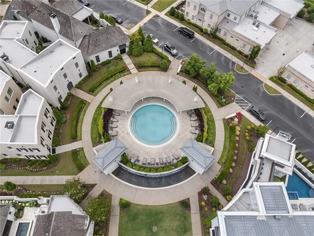 an aerial view of residential house with outdoor space and swimming pool