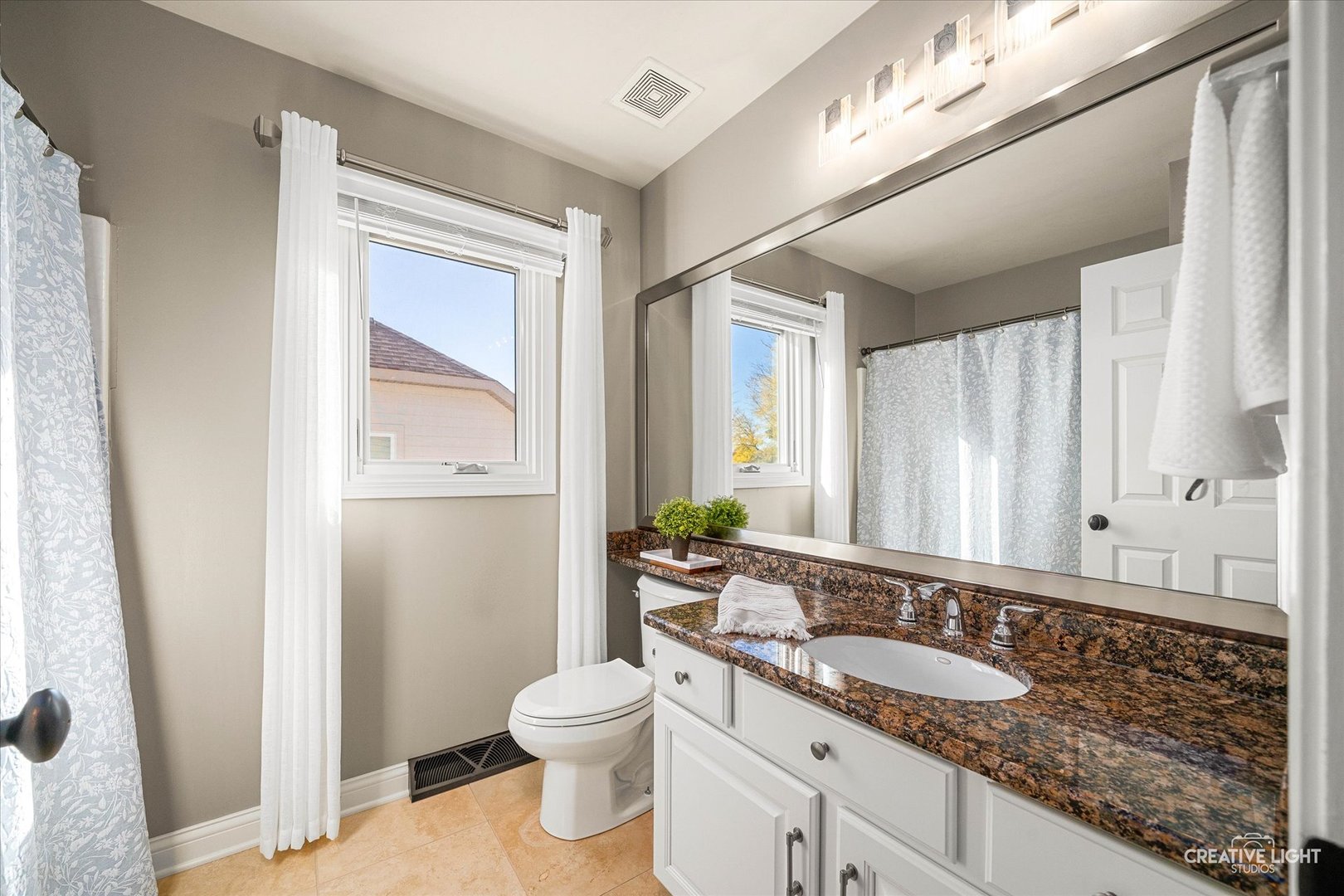 2131 Snow Creek Road Naperville, IL 60564 - Photo 27 of 44 a bathroom with a granite countertop sink toilet and shower