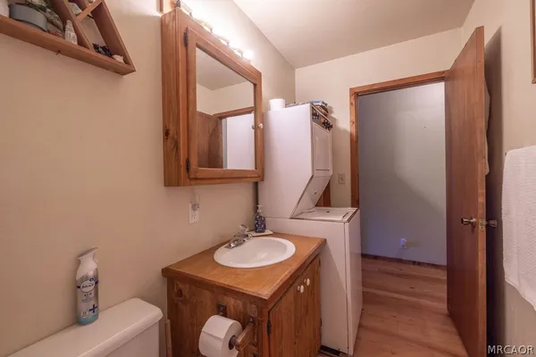 a bathroom with a sink vanity and a mirror