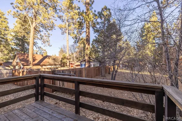 a view of a balcony with trees